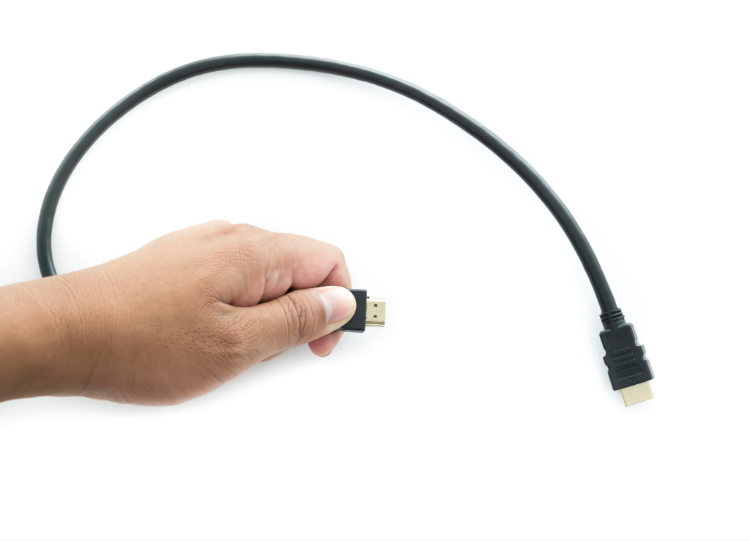 hand-holding-a-hdmi-cable-2026-01-11-10-33-28-utc hand-holding-a-hdmi-cable-2026-01-11-10-33-28-utc