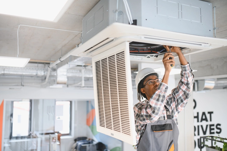 african-american-skilled-technician-repairing-offi-2025-06-06-02-11-27-utc african-american-skilled-technician-repairing-offi-2025-06-06-02-11-27-utc