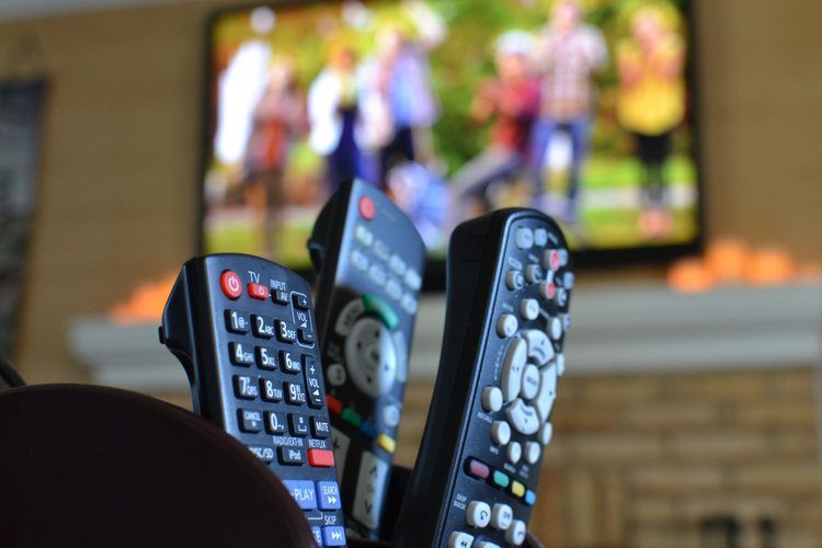 tv-remotes-with-a-television-with-people-playing-f-2025-03-11-18-35-27-utc tv-remotes-with-a-television-with-people-playing-f-2025-03-11-18-35-27-utc